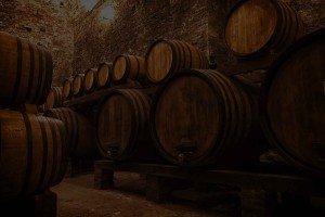 cellar with barrels for storage of wine, Italy